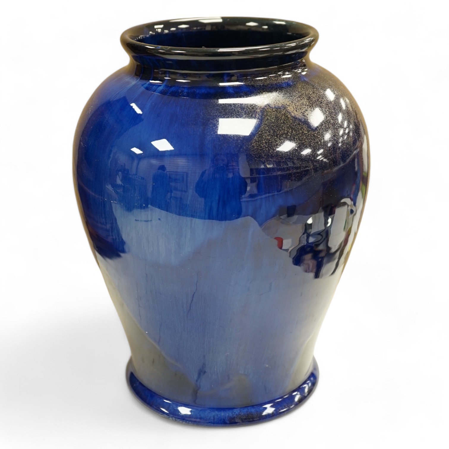 An experimental Doulton Lambeth blue glazed with gilt spray vase, 24cm. Condition - good